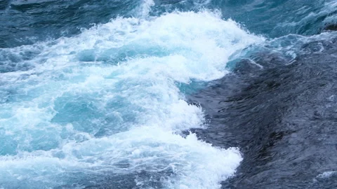 Pure water stream running through stone boulders, Wild mountain river splash 8k Stock Footage 235467110
