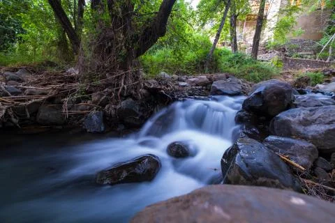 Pure water stream with smooth flow over rocky mountain terrain in the Kakopet Stock Photos