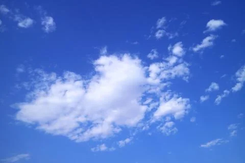 Pure White Clouds Floating on the Vibrant Blue Sky 스톡 사진