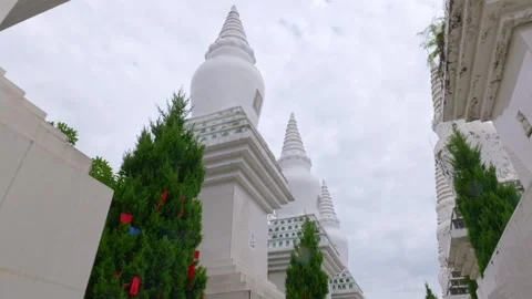 The pure white religious stupa points to the overcast sky. Stock Footage 313541352