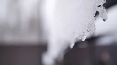 Pure white snow hangs on the eaves of the house. Stock-Footage 229556276