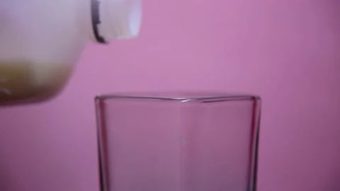Puring milk on glass. 스톡 동영상 131026330