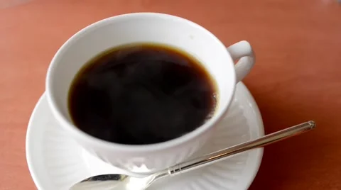 Puring milk into hot black tea drink Stock Footage 65230143