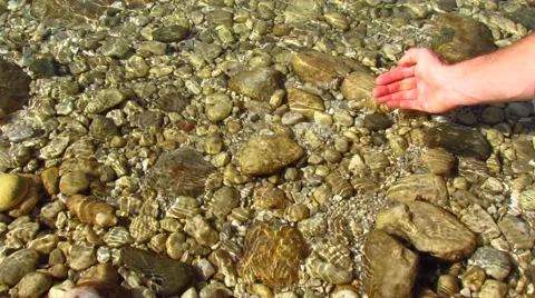 Purity - human hand taking pure water Stock Footage 42541173