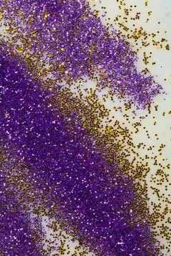 Purple and gold sparkles Stock Photos