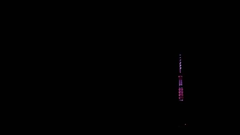 Purple and pink blinking broadcasting antenna tower at night Stock Footage 140065960