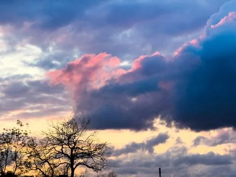 Purple and red clouds Stock Photos