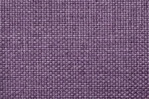 Purple background with braided checkered pattern, closeup. Texture of the wea Stock Photos