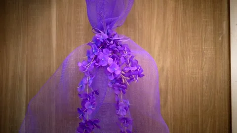 Purple bow with violet sprig attached to the light in Easter time. Tilt 4K Stock-Footage 331450097
