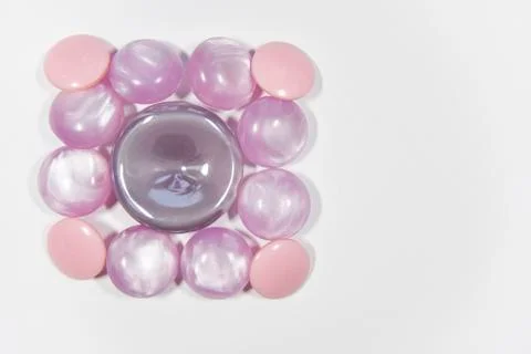 Purple buttons of different shape and size on the white background. Selective Foto stock