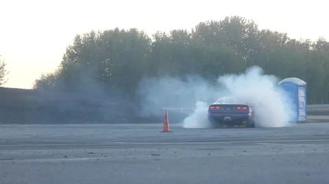 Purple car spins out out on corner while drift racing. Stock Footage 59762026