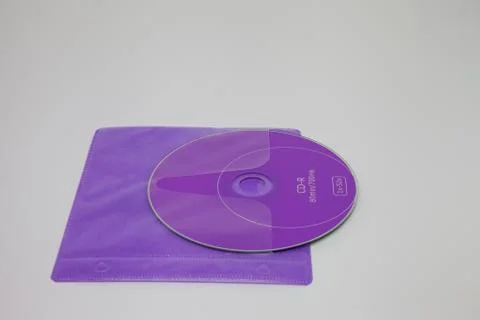 Purple cd disk in square envelope Stock Photos