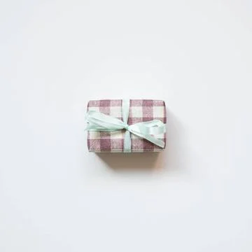 Purple check pattern gift box isolated on white background. top view Purpl... Stock Photos