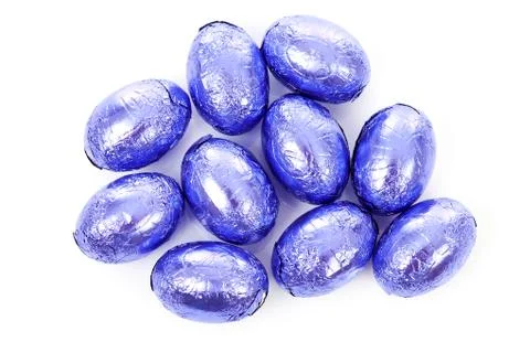 Purple chocolate easter eggs in closeup Stock Photos