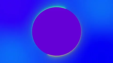 A purple circle with a blue background around which two glow lights circle.  Stock Footage 250556611