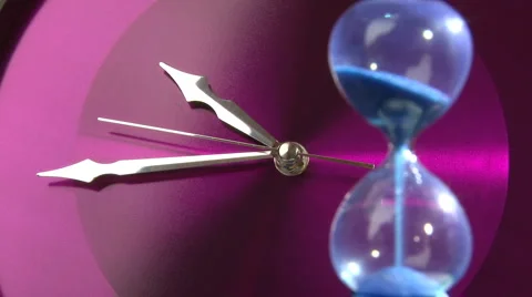 Purple clock and sandclock Stock Footage 1067635