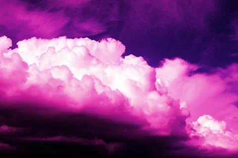 Purple clouds in the dark sky Stock Photos