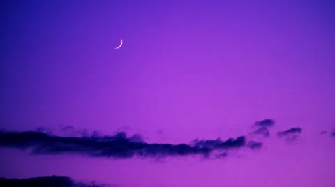 Purple Clouds with Small Moon Stock Footage 53232712