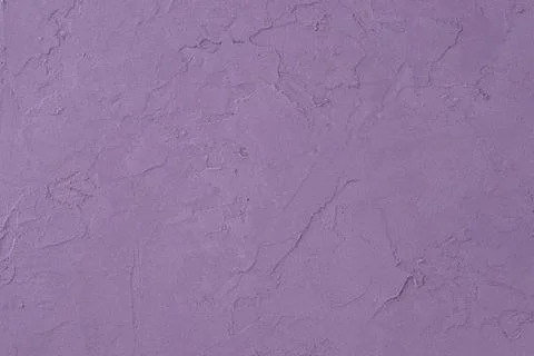 Purple colored decorative plaster surface. Pastel shades purple concrete backgro Stock Photos