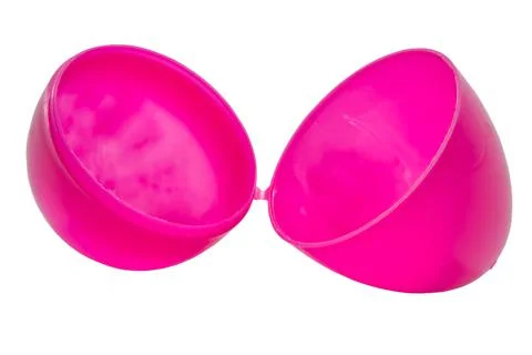 A purple colored plastic egg shell open and isolated on a white background. Stock Photos