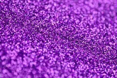 Purple decorative sequins. Background image with shiny bokeh lights from smal Stock Photos