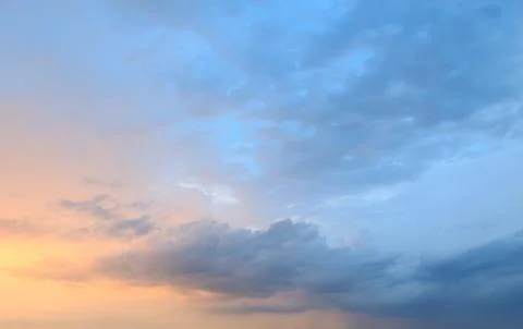 Purple dramatic sunset and blue sky Stock Photos
