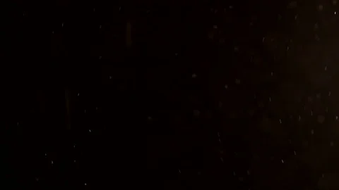 Purple dust particles fly against a dark background Stock Footage 82168559
