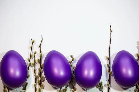 Purple easter eggs with catkins Stock Photos