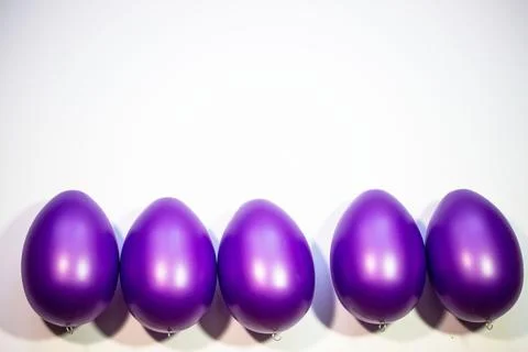 Purple easter eggs on white background Stock Photos