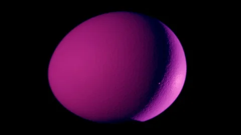Purple egg rotates on black background Stock Footage 104746478