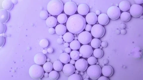 Purple floating bubbles on an oil base. Acrylic paint. Stock Footage 266973722