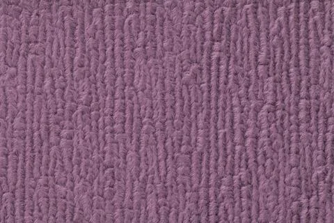 Purple fluffy background of soft, fleecy cloth. Texture of textile closeup Stock Photos
