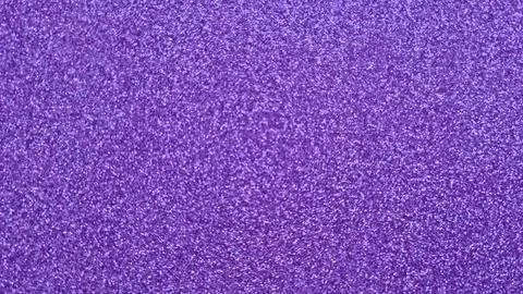 Purple glitter texture background. Close-up view of shimmering violet surface Stock Photos