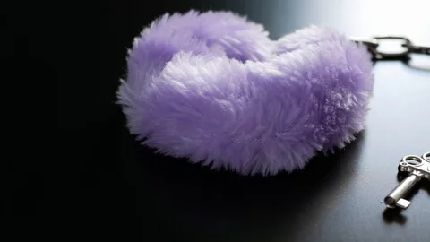 Purple handcuff with key Stock Footage 106024975