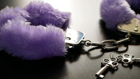 Purple handcuff with key Stock Footage 106024980