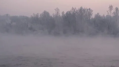 Purple haze over the river at sunset in winter 13 Stock Footage 83745506
