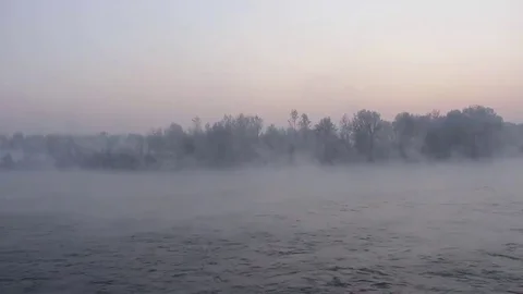 Purple haze over the river at sunset in winter 09 Stock Footage 83745528