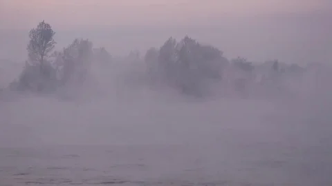 Purple haze over the river at sunset in winter 08 Stock Footage 83745534
