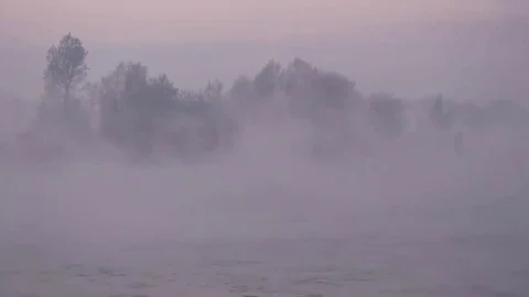 Purple haze over the river at sunset in winter 07 Stock Footage 83745539