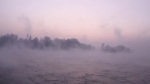 Purple haze over the river at sunset in winter 04 Stock Footage 83745567