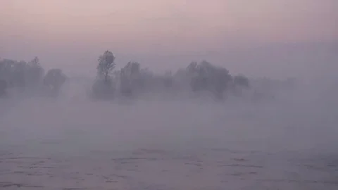 Purple haze over the river at sunset in winter 03 Stock Footage 83745570