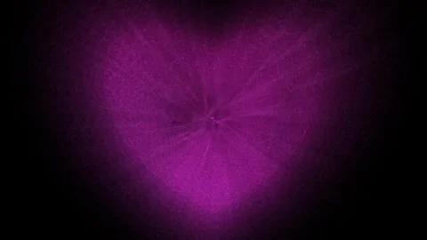 Purple heart made of small particles on a black background. Stock Footage 263615523