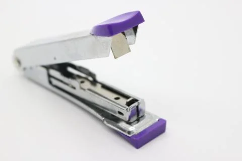 Purple iron stapler Stock Photos