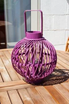The purple lantern standing on the table Stock Photos