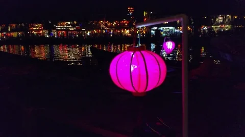 Purple lantern, UHD handheld view of a colrful lantern, infront of Hoi An cit Stock Footage 83505114