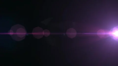 Purple lens flare light effect overlay on black background for cinematic video Video stock 346359464