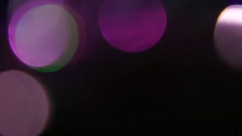 Purple light flickers on a black background. Video stock 309473258