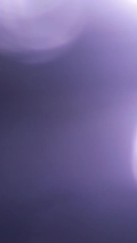 Purple light leak and soft bokeh flare transitions with film grain Stock Footage 341073327