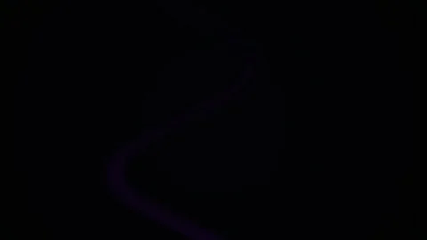 Purple Light Trail Swirling Through Dark Abstract Space with Faint Grid Stock Footage 344724151