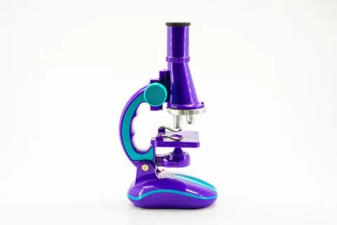 Purple microscope isolated on white. Stock Photos